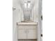 Powder room featuring a white vanity with marble countertop at 290 Winchester Way, Palm Harbor, FL 34684