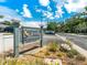 Community sign for Somerset Woods under a blue sky at 290 Winchester Way, Palm Harbor, FL 34684