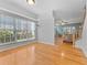 Dining area with large windows and view of the living space at 290 Winchester Way, Palm Harbor, FL 34684