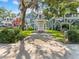 Street view of blue-sided townhouse with carport and U-Box moving container at 290 Winchester Way, Palm Harbor, FL 34684