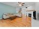 Bright living room with hardwood floors, fireplace, and modern decor at 290 Winchester Way, Palm Harbor, FL 34684