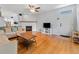 Inviting living room features hardwood floors, fireplace, and ample seating at 290 Winchester Way, Palm Harbor, FL 34684