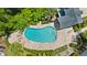 Overhead shot of a refreshing pool with tiled deck area at 290 Winchester Way, Palm Harbor, FL 34684