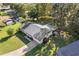 Aerial view of the house showcasing the roof, backyard, and surrounding neighborhood at 31096 Inwood Cir, Brooksville, FL 34602