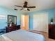 Bedroom featuring a ceiling fan, a closet, and bedroom furnishings at 31096 Inwood Cir, Brooksville, FL 34602