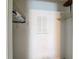 A walk-in closet with minimal design, wire shelving, and hanging clothes at 31096 Inwood Cir, Brooksville, FL 34602