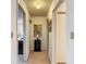 Inviting hallway enhanced by decorative wall art and a stylish console table with complementary lamp at 31096 Inwood Cir, Brooksville, FL 34602