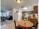 Efficient kitchen space includes wood-look cabinets, appliances, and an eat-in dining area at 31096 Inwood Cir, Brooksville, FL 34602