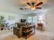 Bright living room with neutral decor, comfortable seating, and stylish furnishings near the entry at 31096 Inwood Cir, Brooksville, FL 34602