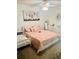Cozy bedroom featuring a comfortable bed, soft lighting, and tasteful decor at 35140 Whispering Oaks Blvd, Dade City, FL 33523