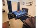 bedroom with a single bed, jeep toy and blue accents at 35140 Whispering Oaks Blvd, Dade City, FL 33523