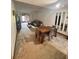 Spacious living room with a dining area and a comfortable gray sofa, illuminated by natural light and a ceiling fan at 35140 Whispering Oaks Blvd, Dade City, FL 33523
