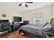 Cozy bedroom featuring hardwood floors and a large window for natural light at 3718 Beneraid St, Land O Lakes, FL 34638