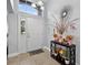 Welcoming entryway with bright interiors, fresh flowers, and a decorative mirror at 3718 Beneraid St, Land O Lakes, FL 34638