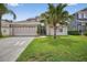 Charming single-story home with well-maintained lawn and inviting curb appeal at 3718 Beneraid St, Land O Lakes, FL 34638