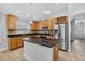 Modern kitchen featuring granite countertops, stainless steel appliances, and a center island at 3718 Beneraid St, Land O Lakes, FL 34638