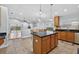 Kitchen with an island, stainless steel appliances, and an adjacent breakfast nook at 3718 Beneraid St, Land O Lakes, FL 34638