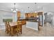 Spacious kitchen featuring stainless steel appliances, granite countertops, and a cozy breakfast nook at 3718 Beneraid St, Land O Lakes, FL 34638
