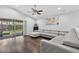Bright living room with sliding glass doors and a comfortable gray couch at 3718 Beneraid St, Land O Lakes, FL 34638