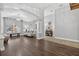 Bright living room features hardwood floors, elegant columns, and a comfortable seating area at 3718 Beneraid St, Land O Lakes, FL 34638