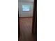 Bedroom with light wood floors, featuring natural light and a view through the doorway, and a neutral wall color at 401 Fern Cliff Ave, Temple Terrace, FL 33617