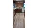 Functional kitchen featuring wood cabinetry, a stainless steel sink, and modern appliances at 401 Fern Cliff Ave, Temple Terrace, FL 33617