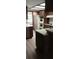 Spacious kitchen featuring wood cabinets, double ovens, and modern appliances at 401 Fern Cliff Ave, Temple Terrace, FL 33617
