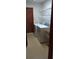 This laundry room features a utility sink, washer, dryer, and wire shelving for convenient storage solutions at 401 Fern Cliff Ave, Temple Terrace, FL 33617