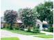 Charming single story home with a well manicured lawn, driveway and covered carport at 402 Evergreen Dr, Oldsmar, FL 34677