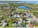 A landscape view reveals this lovely neighborhood with a lake and lush landscaping at 408 Georgia Ave, Crystal Beach, FL 34681