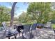 Relaxing back deck area with seating, fire pit, and serene green views at 408 Georgia Ave, Crystal Beach, FL 34681