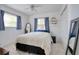 Cozy bedroom with carpet, closet, and natural light from two windows at 408 Georgia Ave, Crystal Beach, FL 34681