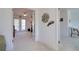Bedroom with open entry featuring decor on wall and ceiling fan above at 408 Georgia Ave, Crystal Beach, FL 34681