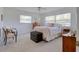 Relaxing bedroom boasts two windows, carpet and cozy seating at 408 Georgia Ave, Crystal Beach, FL 34681