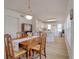 Bright dining area showcases wood floors, natural light, and access to the kitchen at 408 Georgia Ave, Crystal Beach, FL 34681