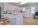 Bright kitchen features stainless appliances, stone countertops, and ample cabinet space at 408 Georgia Ave, Crystal Beach, FL 34681