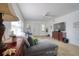 Bright living room with a comfortable gray sectional sofa and modern wood laminate floors at 408 Georgia Ave, Crystal Beach, FL 34681