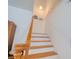 Close-up of the staircase features wood floors and a charming railing at 408 Georgia Ave, Crystal Beach, FL 34681