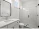 Bathroom with frameless glass shower, modern vanity, and sleek fixtures at 4114 W Neptune St, Tampa, FL 33629