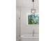 This stunning bathroom offers a standalone tub and a glass enclosed shower with sleek fixtures at 4114 W Neptune St, Tampa, FL 33629