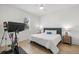 Bright bedroom with hardwood floors, a ceiling fan, and a stationary bicycle for convenient workouts at 4114 W Neptune St, Tampa, FL 33629
