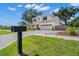 Beautiful two-story home with a spacious front yard, charming curb appeal, and a brick-paved driveway at 4114 W Neptune St, Tampa, FL 33629