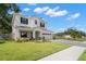 Charming two-story home with a well-manicured lawn and a three-car garage at 4114 W Neptune St, Tampa, FL 33629