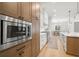 Well-equipped kitchen featuring a stainless steel microwave and wood accents throughout at 4114 W Neptune St, Tampa, FL 33629