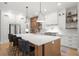 Gourmet kitchen with a central island, quartz countertops, and stainless steel appliances at 4114 W Neptune St, Tampa, FL 33629