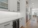 Elegant kitchen with custom cabinets, stainless steel appliances, and a wine refrigerator at 4114 W Neptune St, Tampa, FL 33629