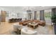 Open-concept living room and kitchen with hardwood floors and stylish furnishings at 4114 W Neptune St, Tampa, FL 33629