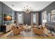 Elegant living room featuring a sailboat TV display, modern chandelier, and stylish decor at 4114 W Neptune St, Tampa, FL 33629