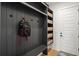 Well-organized mudroom with dark gray shiplap, built-in bench, and ample storage at 4114 W Neptune St, Tampa, FL 33629