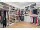 Spacious walk-in closet with custom shelving and ample storage for clothes, shoes, and accessories at 4114 W Neptune St, Tampa, FL 33629